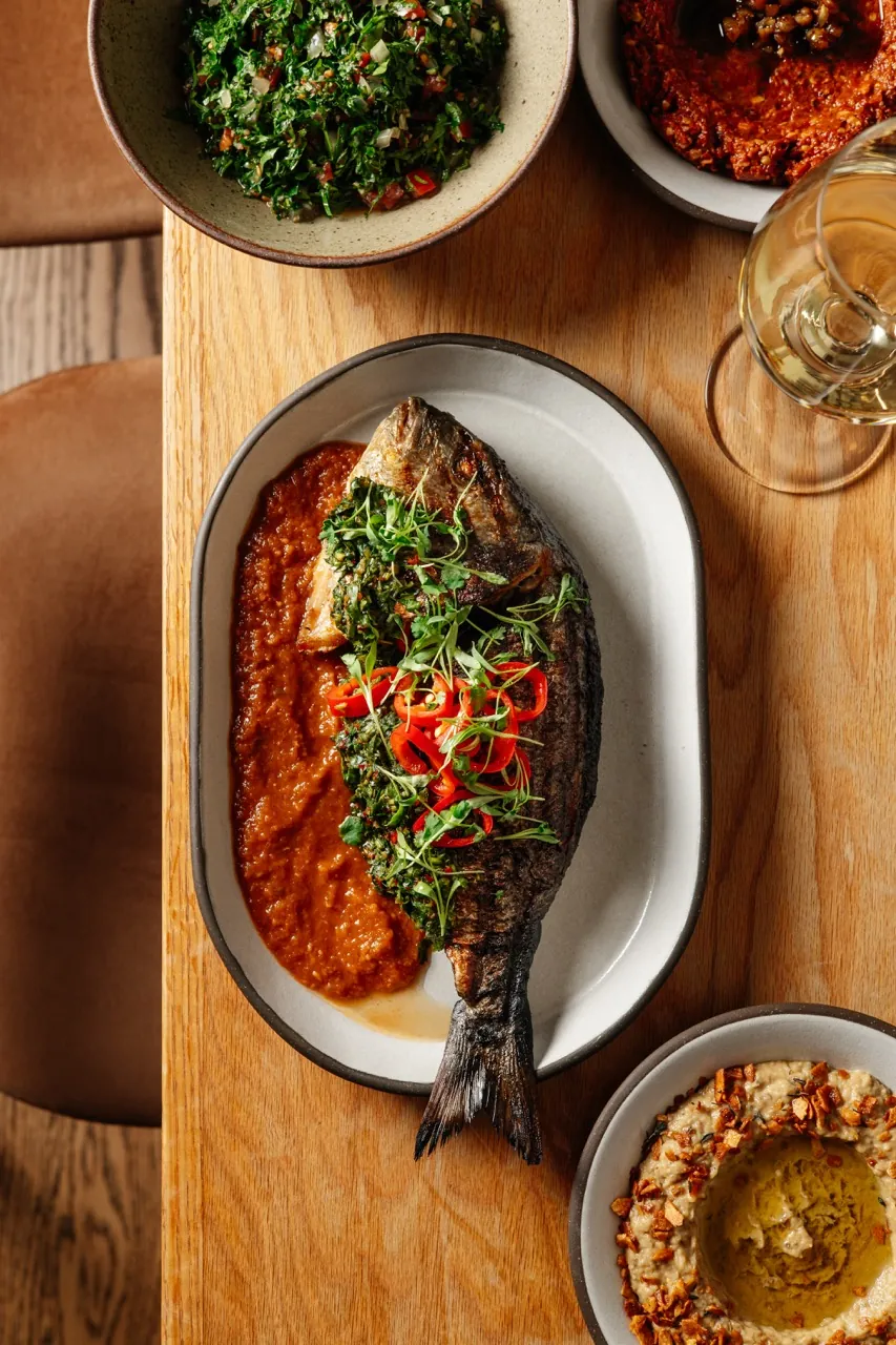 Tripoli samke harra, whole dorade with tahini and walnut